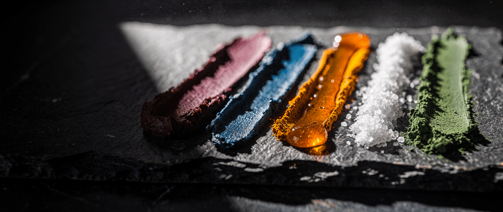cheechaa natural ingredients and botanicals on a dark surface