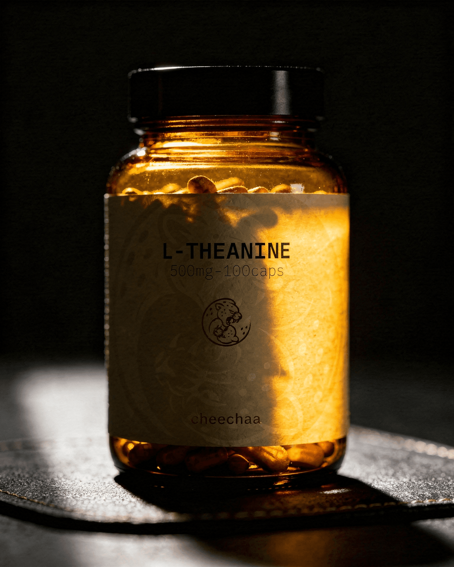 cheechaa l-theanine supplement jar beside green tea leaves