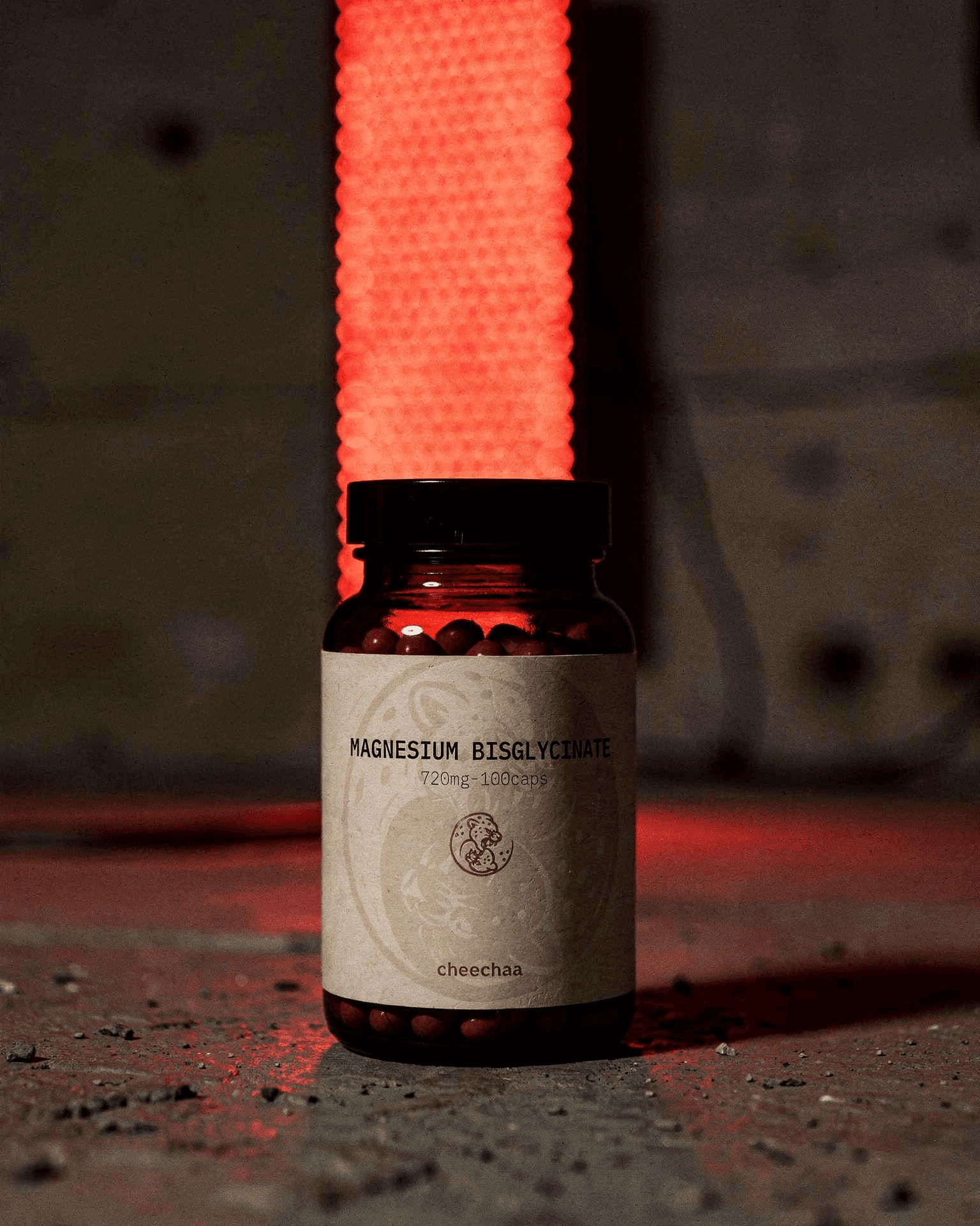 cheechaa magnesium bisglycinate supplement jar on a bedside table at dusk