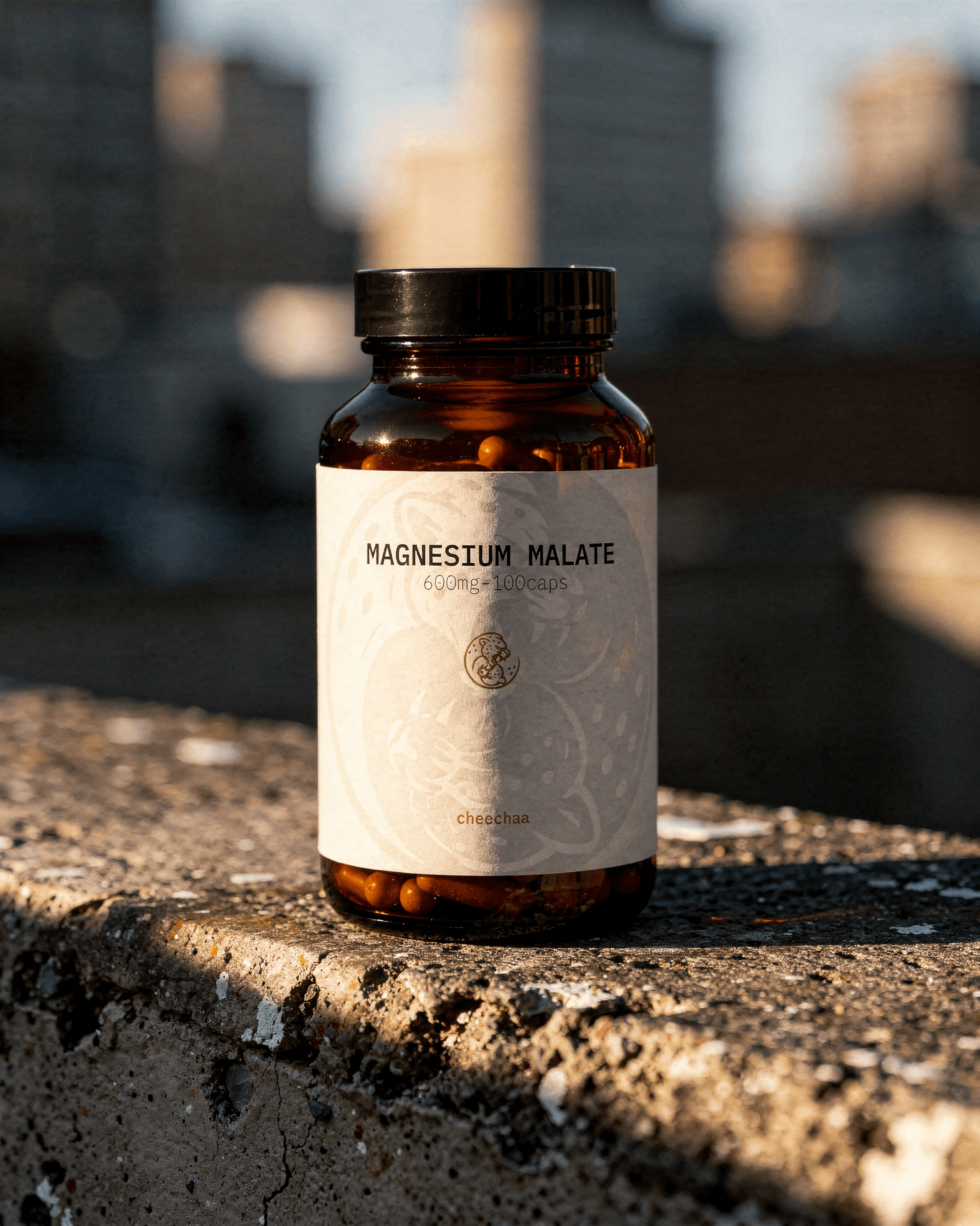 cheechaa magnesium malate supplement jar beside a training towel after exercise